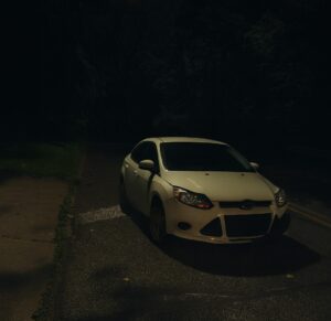 Late-night car accident scene outside author's house.